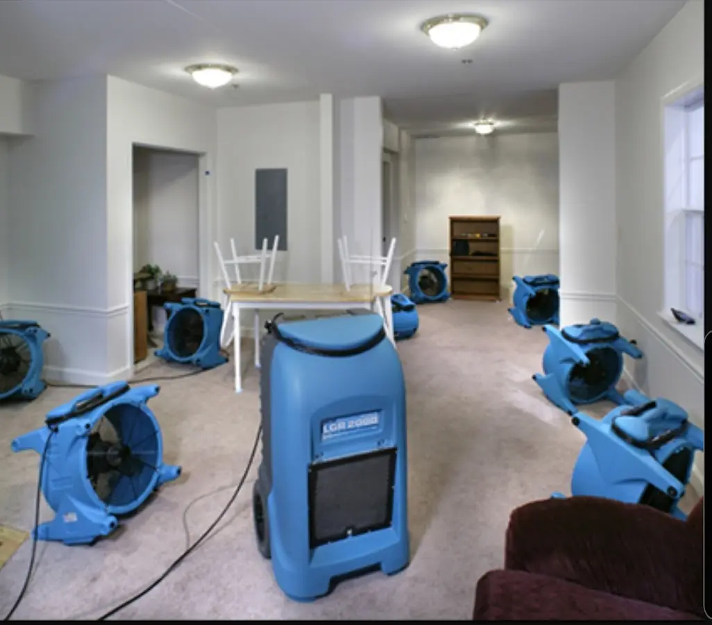 Air movers and dehumidifier setup for Water Damage Restoration in Elmira
